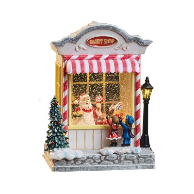 מנורת תפאורה לכריסמס - סנטה בחנות ממתקים