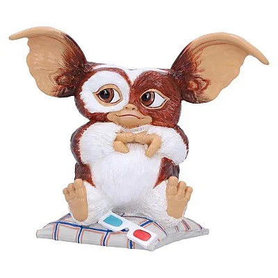 פסלון גיזמו על כרית עם משקפי תלת מימד