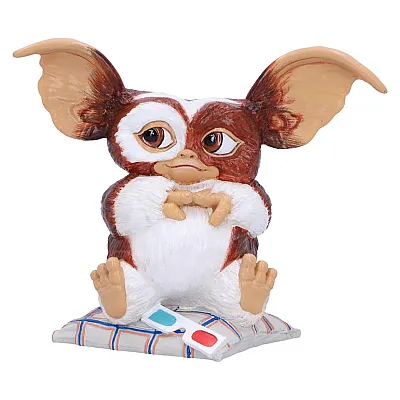 פסלון גיזמו על כרית עם משקפי תלת מימד